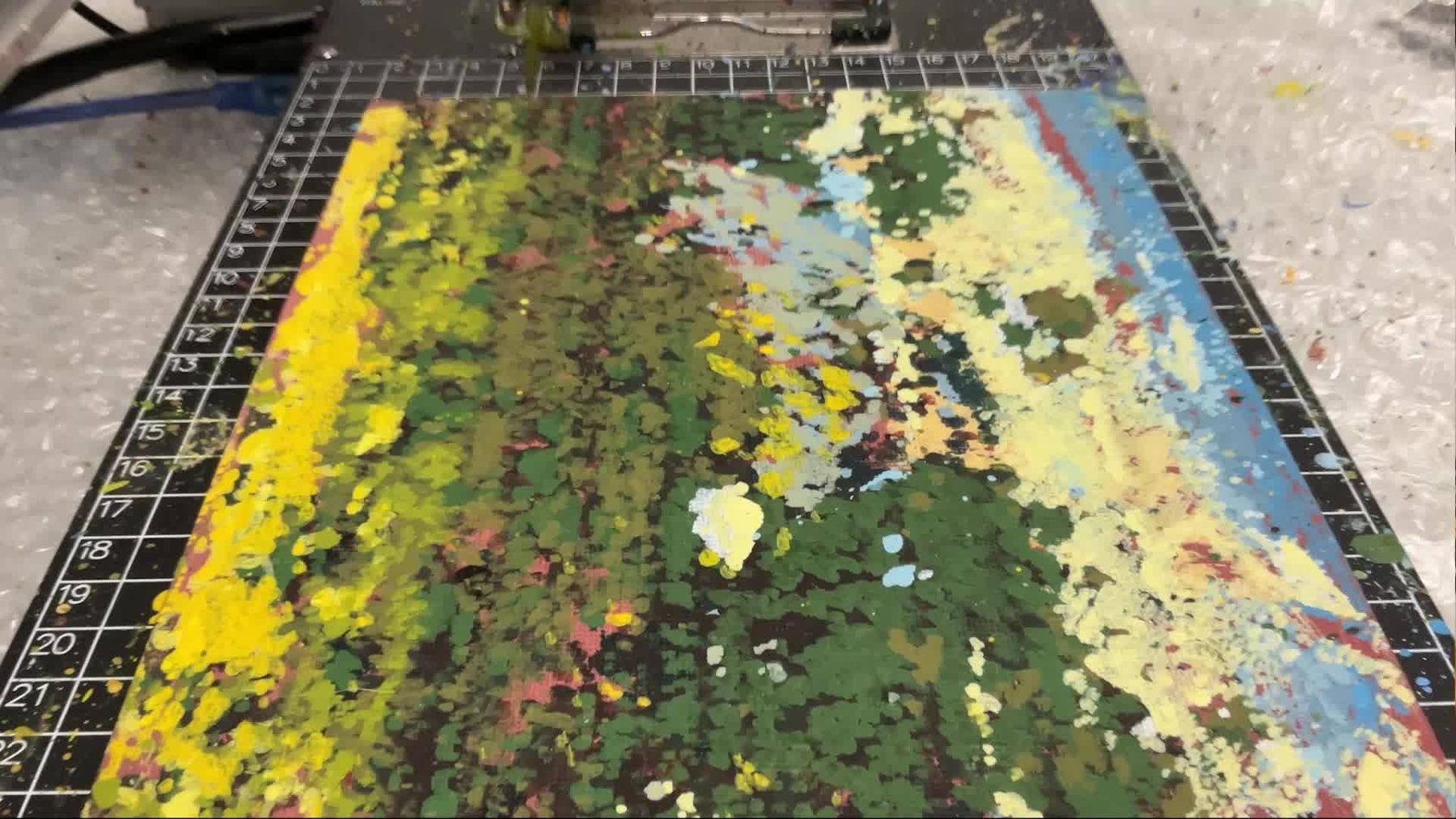 Close-up of oil strokes laid down by the machine