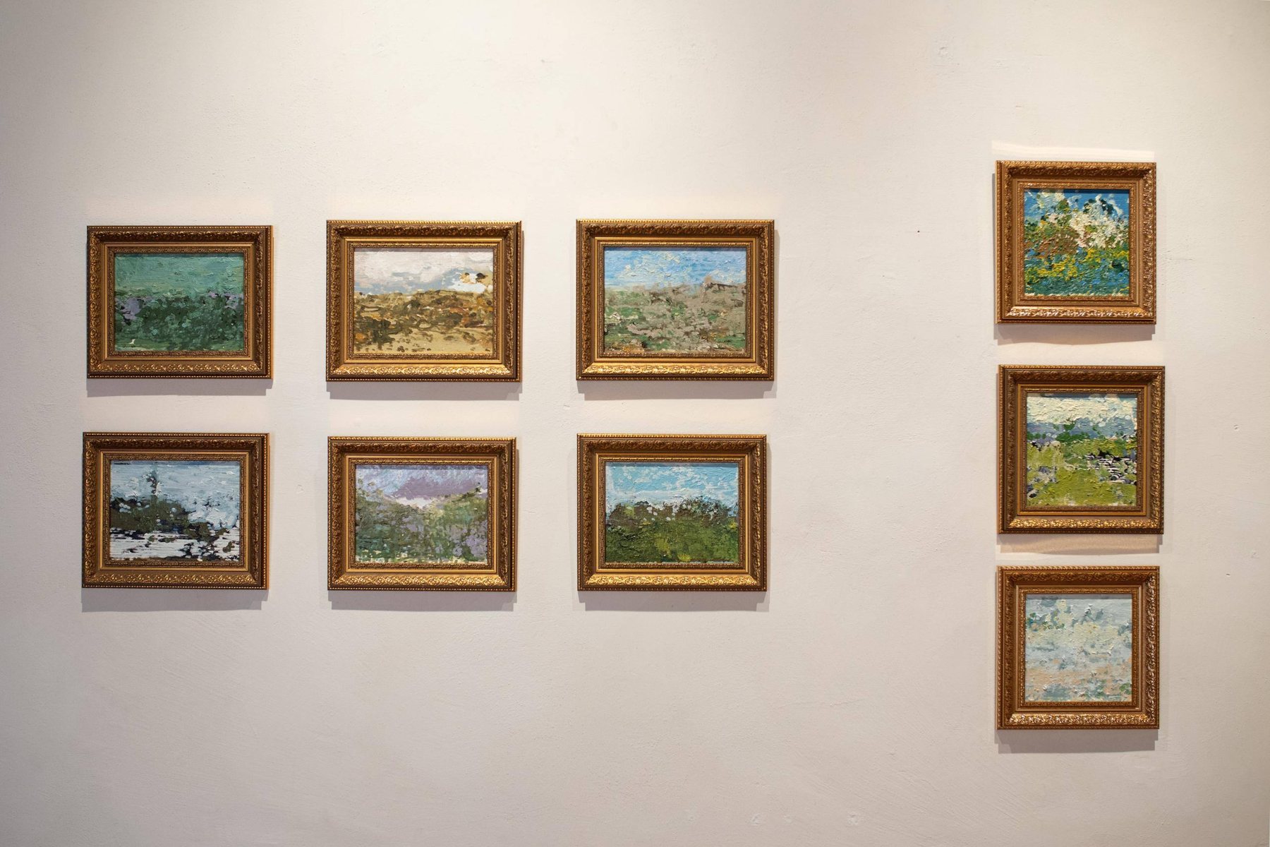 Small framed landscape paintings in gilded frames